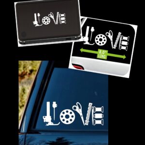 Decorative white tool-themed 'LOVE' sticker applied to a car window, with letters formed by tools and gear shapes.