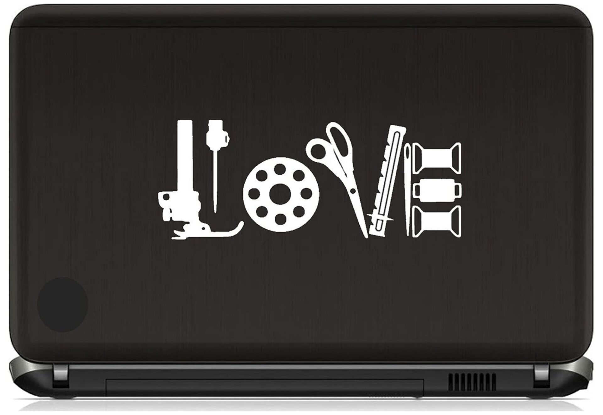 Laptop lid featuring white 'LOVE' made from office tools (stapler, scissors, ruler, tape, clips, and spools)