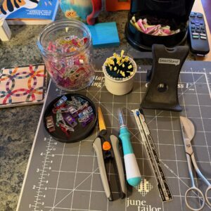 The Tools and Notions right next to my sewing machine - including the quilt Barn Coaster